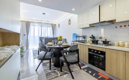 a kitchen and dining room with a table and chairs at Vibyqa cosy and vibes in Nairobi
