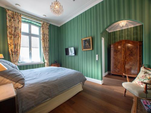 Ένα ή περισσότερα κρεβάτια σε δωμάτιο στο Rooms GUT HEIDEFELD