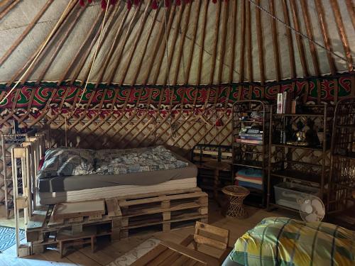 a bedroom with a bed in a yurt at Weddeloase in Medebach