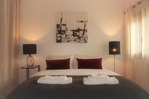 Ένα ή περισσότερα κρεβάτια σε δωμάτιο στο Cascais Accommodations Series