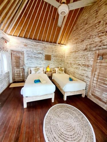 Katil atau katil-katil dalam bilik di Kakiang Guesthouse