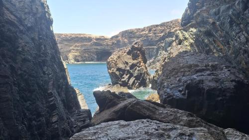 a view of the ocean from a rocky cliff at Grande Maison Rurale in Tuineje