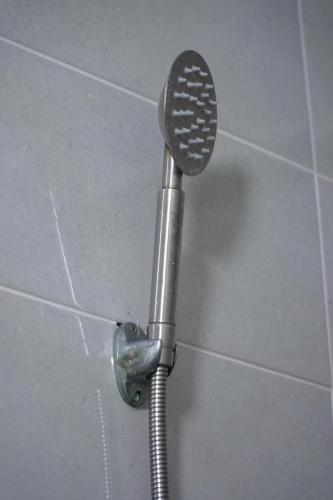 a shower head in a shower stall in a bathroom at MGi2 in Aït Moussa Ou Amar