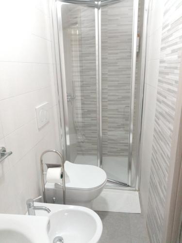 a bathroom with a shower and a toilet and a sink at Apulian Bluemoon House in Molfetta