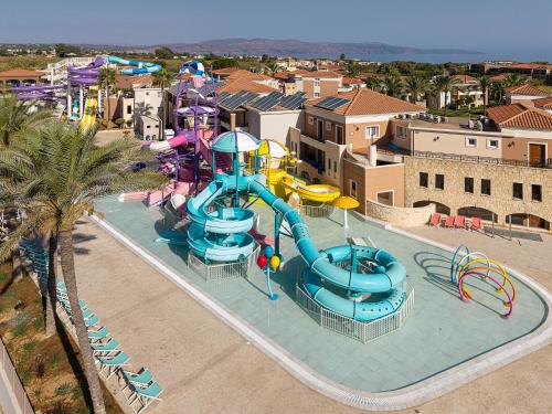 an aerial view of a water park with a water slide at Caldera Beach in Plataniás