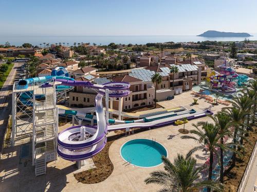 an aerial view of a water park with a water slide at Caldera Beach in Plataniás