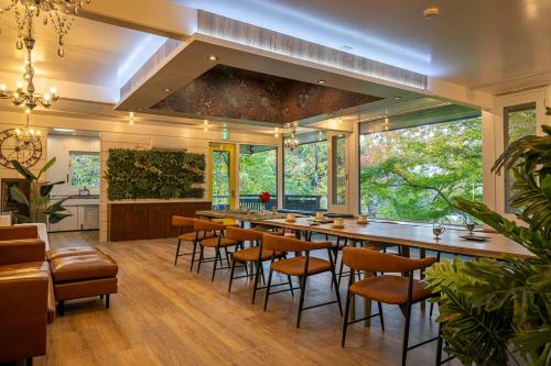 a large dining room with a long table and chairs at 2 Onsens in-Villa #Private hot-spring Villa in Hakone in Hakone