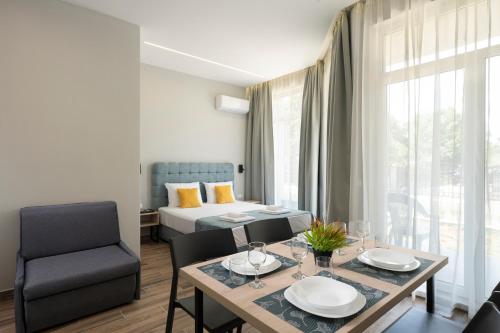 Ένα ή περισσότερα κρεβάτια σε δωμάτιο στο Costa Azzurra Apartments