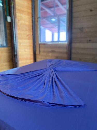 a blue umbrella sitting on top of a table at Brisas del Mar Barú in Playa Blanca