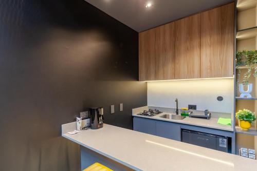 a kitchen with a sink and a counter top at Blok Living in Medellín
