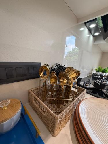 a room with a table and a basket of plants at Atrium by Bali in New Delhi