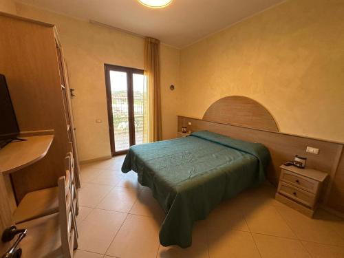 a bedroom with a bed and a window at Il Rifugio dell'Orso in Castel di Sangro