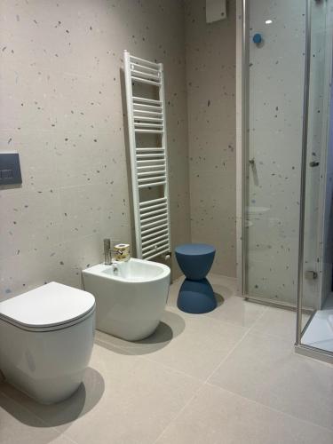 a bathroom with a toilet and a sink and a shower at Domus Eterea in Marsala