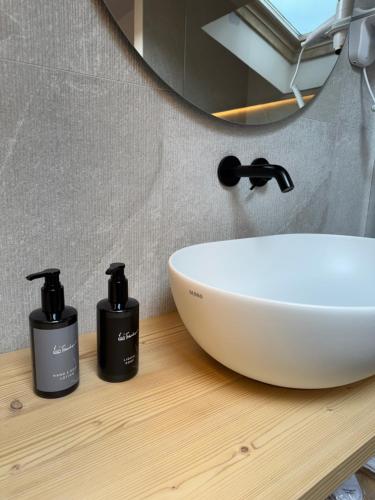 a bathroom with a sink and a mirror at Hotel Nevada in Bormio