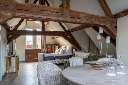 a living room with a table and a couch at Rooms With A View in Ghent