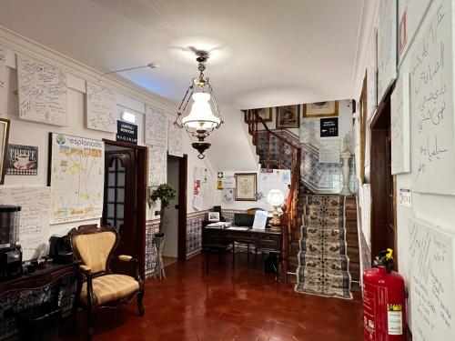 an office with a hallway with a desk and a room at HOTEL BOUTIQUE a ESPLANADA in Castelo Branco