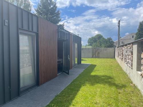 an external view of a building with a grass yard at Modul Monika in Turčianske Teplice