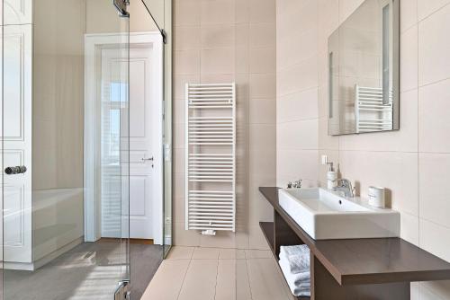 a bathroom with a sink and a shower at 6 rooms in Vienna