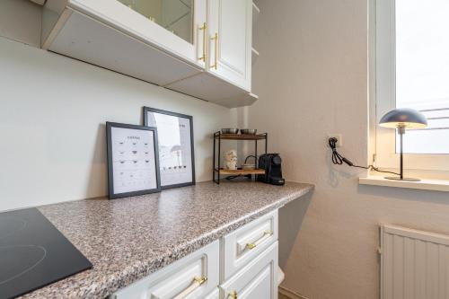 Η κουζίνα ή μικρή κουζίνα στο Apartmenthaus in Neumünster