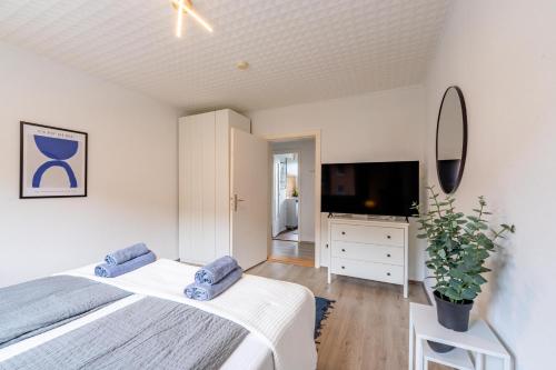 Ένα ή περισσότερα κρεβάτια σε δωμάτιο στο Apartmenthaus in Neumünster