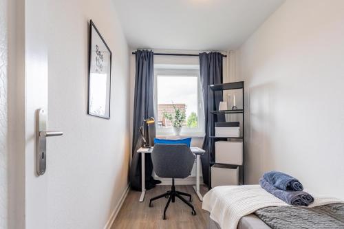 Ένα ή περισσότερα κρεβάτια σε δωμάτιο στο Apartmenthaus in Neumünster