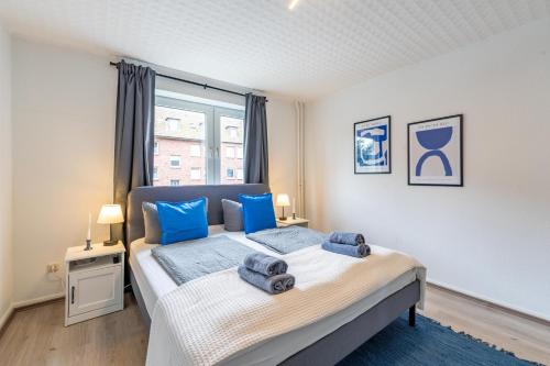 Ένα ή περισσότερα κρεβάτια σε δωμάτιο στο Apartmenthaus in Neumünster