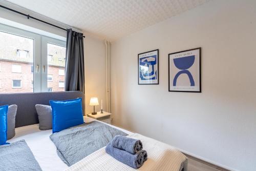 Ένα ή περισσότερα κρεβάτια σε δωμάτιο στο Apartmenthaus in Neumünster