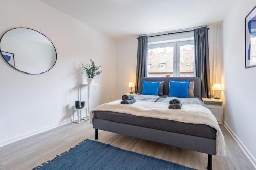 Ένα ή περισσότερα κρεβάτια σε δωμάτιο στο Apartmenthaus in Neumünster