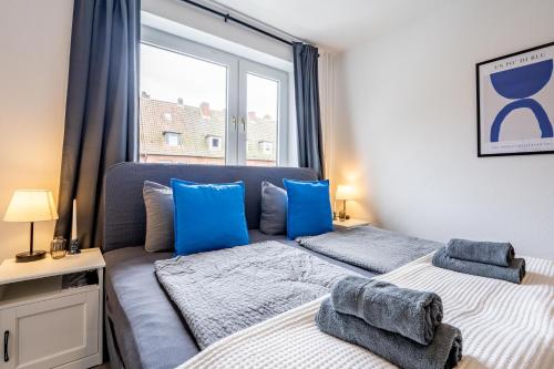 Ένα ή περισσότερα κρεβάτια σε δωμάτιο στο Apartmenthaus in Neumünster