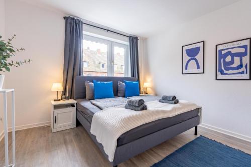 Ένα ή περισσότερα κρεβάτια σε δωμάτιο στο Apartmenthaus in Neumünster