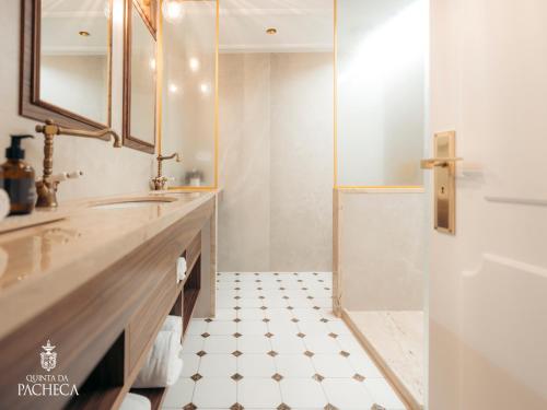 a bathroom with a sink and a shower at Pacheca The Wine House Hotel e Spa - Quinta da Pacheca in Lamego