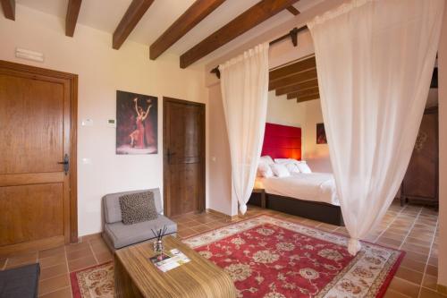 a bedroom with a bed and a couch and a table at Elegant Dream Home in Consell City, 1021 in Consell