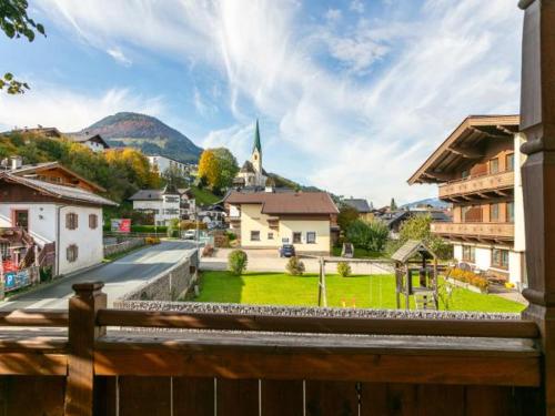 a view of a town from a wooden fence at Gästehaus Roland in Kirchberg in Tirol