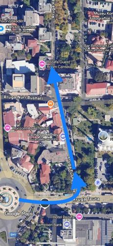 a map of a street with a blue arrow at Rozafa Guest Room Center in Shkodër