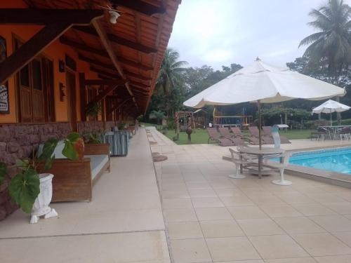 Kolam renang di atau dekat dengan Hotel Fazenda Colibri