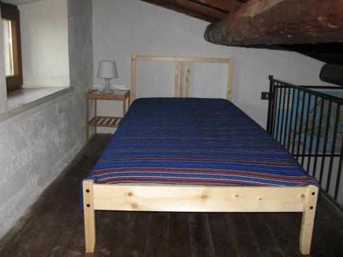 A bed or beds in a room at Monolocale Pareti Tocco