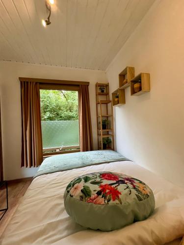 a bedroom with a bed with a pillow on it at L'Échappée verte in Waulsort