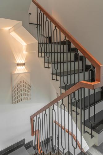 a staircase with a light on the wall at Soul Station - Studio Hotel II in Ho Chi Minh City