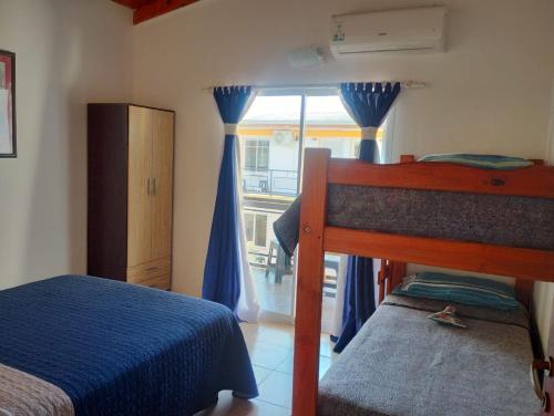 Postel nebo postele na pokoji v ubytování Departamentos lo de Juan