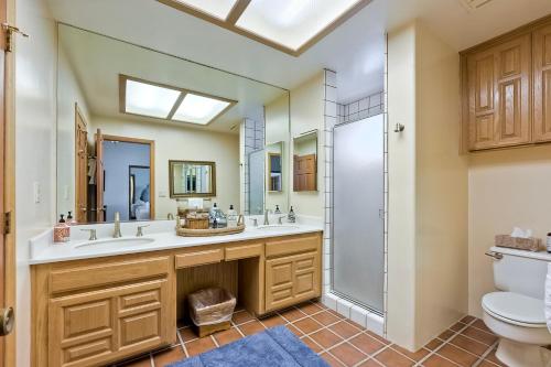 a bathroom with two sinks and a shower at Exclusive Beachfront Duplex in Carlsbad Village Ocean Views, Sleeps 9 in Carlsbad