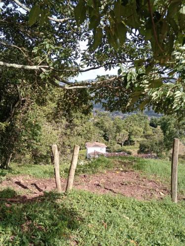 a fence in the middle of a field at Apto CUEVA DEL OSO PARAMILLO 2 Hab 4 Pax in San Cristóbal