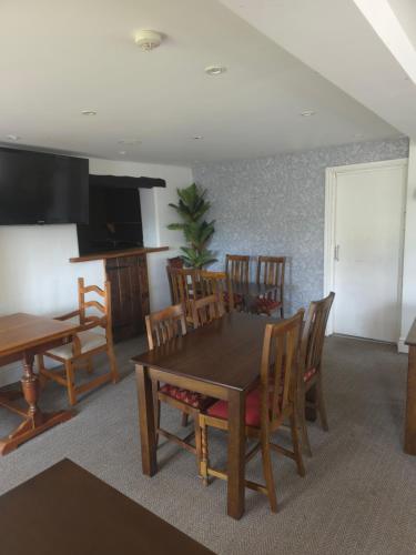 a dining room with a table and chairs at The Royal Oak Inn, Rhandirmwyn in Rhandirmwyn