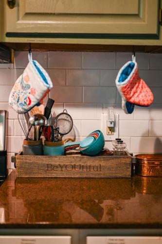 a kitchen counter with two knitted mitts on the wall at The Robins Nest with hot tub in Pigeon Forge