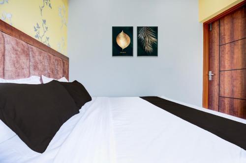 Ένα ή περισσότερα κρεβάτια σε δωμάτιο στο Hotel O Pankh