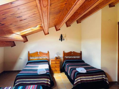 Ένα ή περισσότερα κρεβάτια σε δωμάτιο στο Casa familiar en Morella
