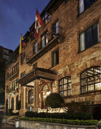 a building with the seasons hotel at night at Four Seasons Hotel Casa Medina Bogota in Bogotá