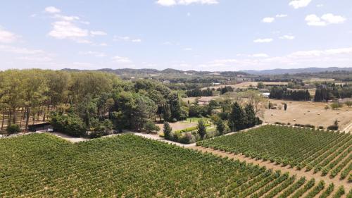 an aerial view of the wineryyards and vineyards at the winery at at La Jasso Hôtel, Maison de Famille in Carcassonne