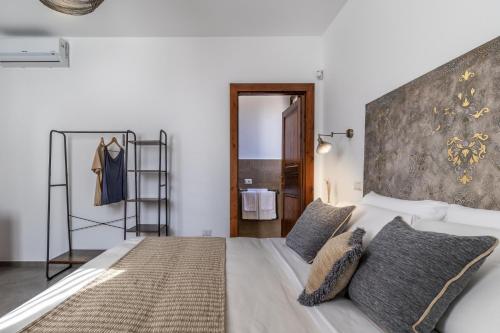 Postel nebo postele na pokoji v ubytování Villa Denu Salento - Intera Dimora con Piscina ad uso esclusivo
