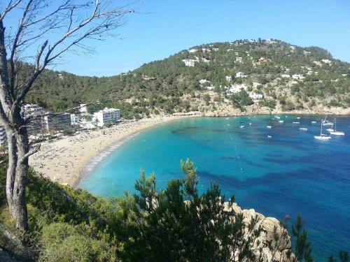 a view of a beach with boats in the water at Mallorca Villa 1463: Relax in Your Private Oasis in Deia