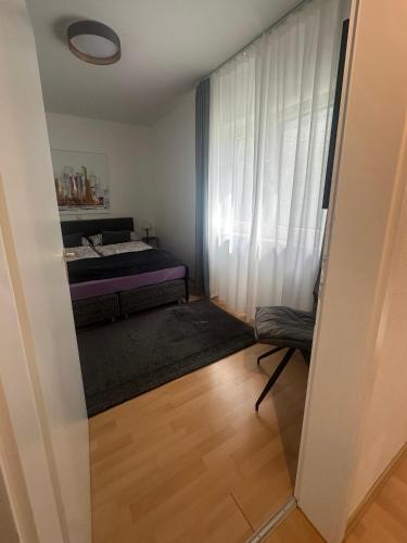 a small room with a bed and a window at Haus Seeblick Apartments mit PKW-Stellplatz am Haus in Überlingen